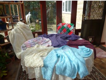 Various garments created by the 'Woollen Tops'